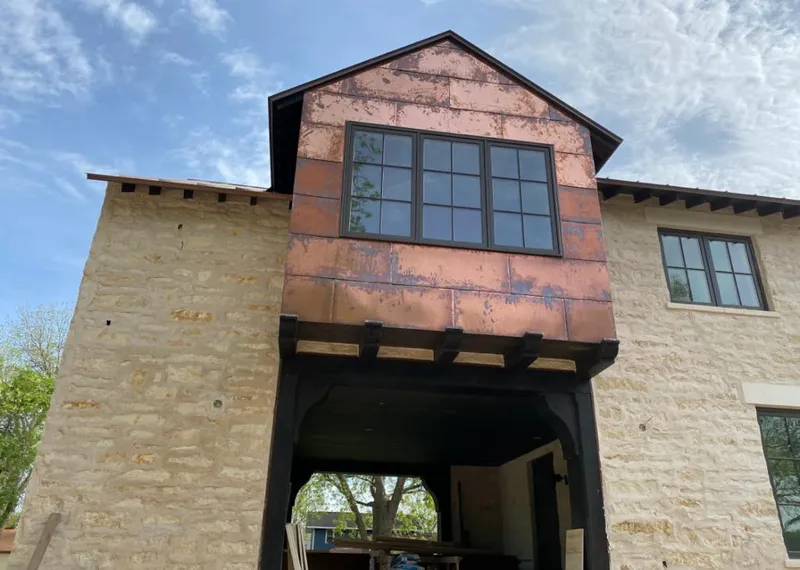 Copper metal panel facade on a stone building for Roof Repair in Hillsborough